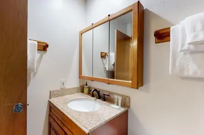 a bathroom with a sink and a mirror at Val D'Isere 30 in Mammoth Lakes