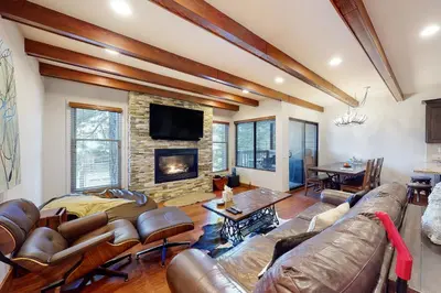 a living room with a couch and a fireplace at Val D'Isere 16 in Mammoth Lakes