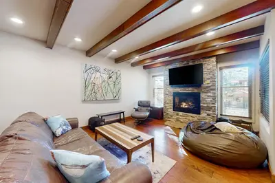 a living room with a couch and a fireplace at Val D'Isere 16 in Mammoth Lakes