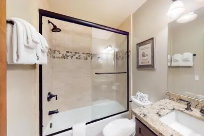 a bathroom with a shower and a toilet and a sink at Val D'Isere 16 in Mammoth Lakes