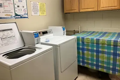 a laundry room with a washer and dryer at Sierra Megeve 3 in Mammoth Lakes