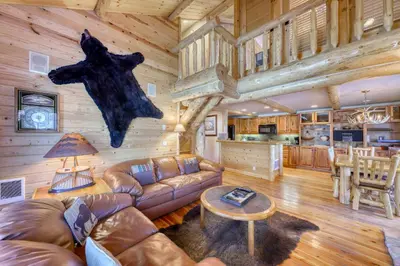a living room with a couch and a table at Sierra Megeve 29 in Mammoth Lakes