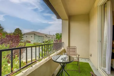 a balcony with a table and chairs and a view at Home Base with Easy 1-80 Access 4 Mi to Dtwn Reno! in Reno