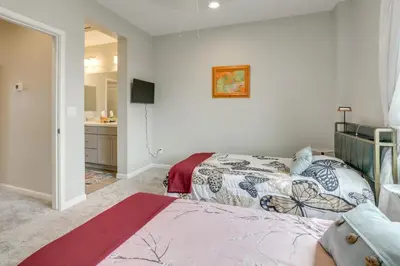 a bedroom with a bed and a sink at Home Base with Easy 1-80 Access 4 Mi to Dtwn Reno! in Reno