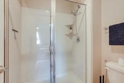 a shower with a glass door in a bathroom at Home Base with Easy 1-80 Access 4 Mi to Dtwn Reno! in Reno