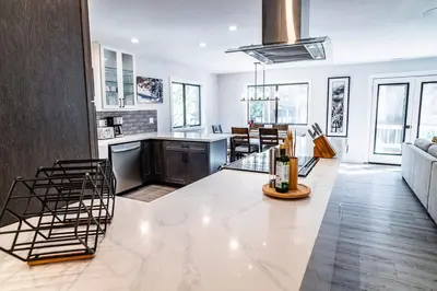 a kitchen and living room with a large white counter top at Mammoth Lakes Ski Getaway in Mammoth Lakes