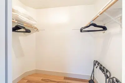 a room with white walls and wooden floors at Modern Western Retreat Pet Friendly 4 Bed 2 Bath in Reno