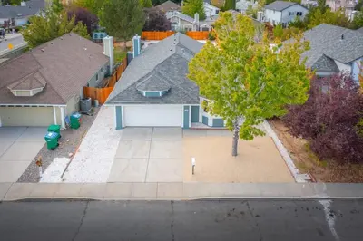 an aerial view of a house with a tree at Modern Western Retreat Pet Friendly 4 Bed 2 Bath in Reno