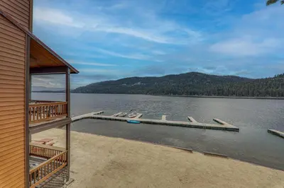 a house on a lake with a dock at Townhouse wLake View #254 at Donner Lake Village in Truckee