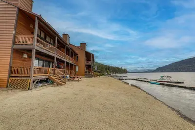 a building on the shore of a body of water at Townhouse wLake View #254 at Donner Lake Village in Truckee