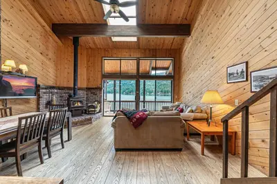 a living room with a couch and a table at Townhouse wLake View #254 at Donner Lake Village in Truckee