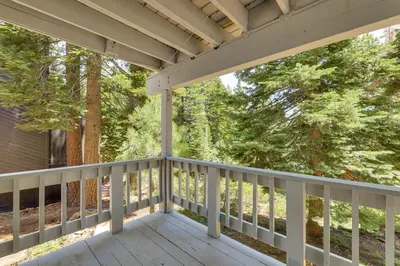 a porch with white railings and trees at 3 Mi to Lake Tahoe Forest-View Sanctuary with Deck! in Incline Village