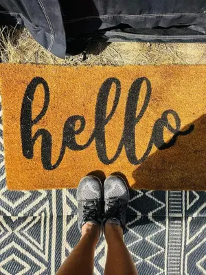 a person with their feet on a sign with the word fire at Rocky Ridge Glamping Yosemite in Coarsegold