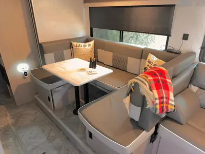 a small dining room with a table in a caravan at DDs Country Camper in Reedley