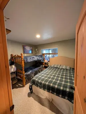 a bedroom with a bed and a couch at Kirkwood On Meadow 3br 1 ba in Kirkwood