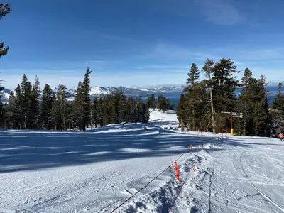 a snow covered ski slope with trees on the side at Lake Village Resort 3 bedroom condo in Zephyr Cove