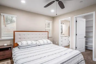 a bedroom with a bed and a ceiling fan at The Oakhurst Oasis - Family & Fun Edition in Oakhurst