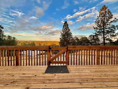 a wooden deck with a bench on top of it at Unique Container, Home 20 Acres, Modern Stay in Placerville