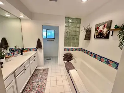 a bathroom with a tub and a sink at Ranch Stay-A 240 acre Working Ranch in Granite Bay