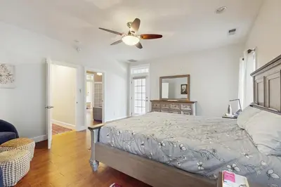 a bedroom with a bed and a ceiling fan at Games, Covered Deck Family Home 28 Mi to Yosemite in Groveland