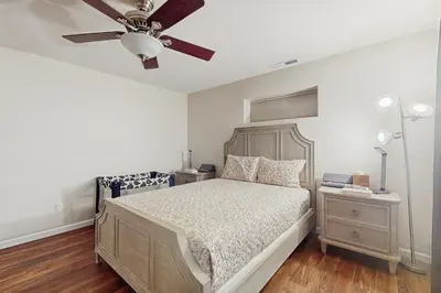 a bedroom with a bed and a ceiling fan at Games, Covered Deck Family Home 28 Mi to Yosemite in Groveland