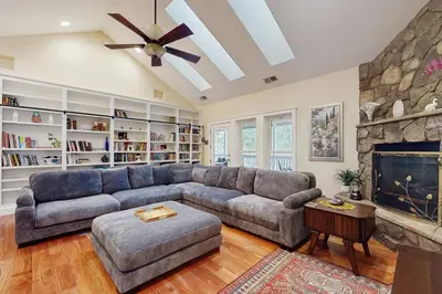 a living room with a couch and a fireplace at Games, Covered Deck Family Home 28 Mi to Yosemite in Groveland