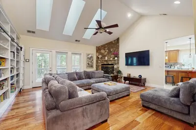 a living room with two couches and a ceiling fan at Games, Covered Deck Family Home 28 Mi to Yosemite in Groveland