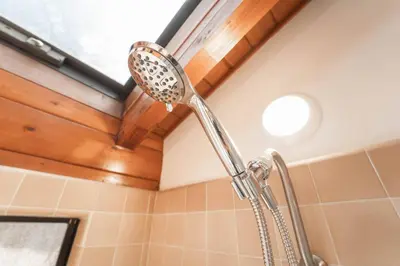 a shower in a bathroom with a shower head at Sequoia Vintage A-frame River Retreat in Three Rivers