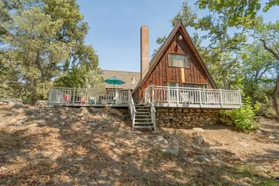 a house on a hill with stairs and a porch at Sequoia Vintage A-frame River Retreat in Three Rivers