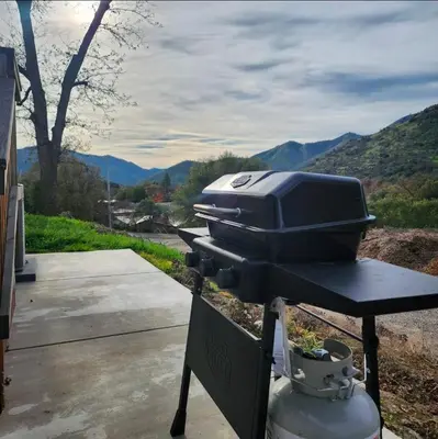 a grill sitting on top of a table at Home away from Home - 6 miles from the SNP in Three Rivers