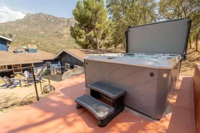 a hot tub sitting on the roof of a house at Gateway To Sequoia River House in Three Rivers