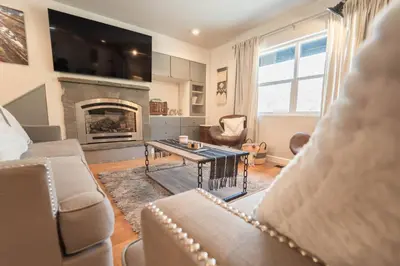 a living room with a couch and a fireplace at Gateway To Sequoia River House in Three Rivers