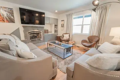 a living room with a couch and a fireplace at Gateway To Sequoia River House in Three Rivers