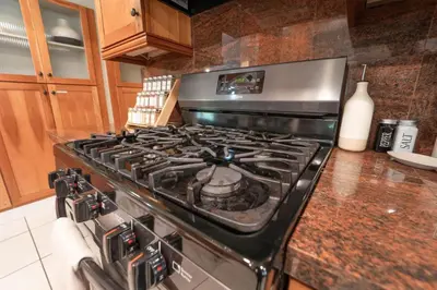 a stove top oven sitting in a kitchen at Gateway To Sequoia River House in Three Rivers