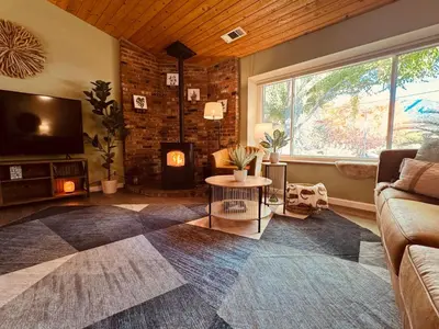 a living room with a couch and a fireplace at Magic Sequoia Spacious Home in Three Rivers