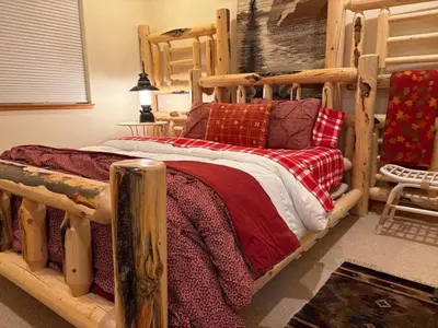 a bedroom with a wooden bed with red pillows at Large 3 Bedrooms Outdoor Seating in Tahoe Vista