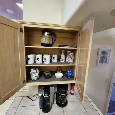 a cupboard with a tea kettle and pots and pans at The Gathering Spot-6 miles from Sequoia Nlt'l Park in Three Rivers