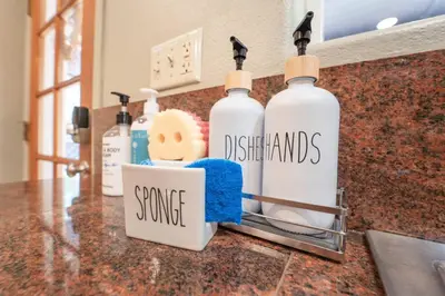 a counter with four bottles of detergents on it at Riverside Retreat in Three Rivers - Natures Paradise in Three Rivers