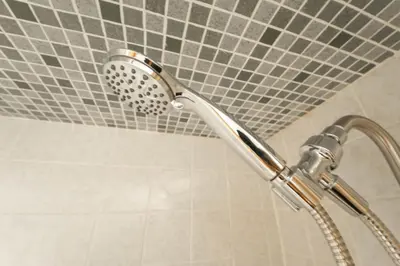 a shower with a shower head in a bathroom at Sequoia Vintage A-frame River Retreat in Three Rivers