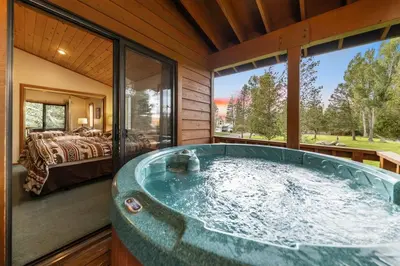 a jacuzzi tub in a room with a bedroom at 589 Danube Drive condo in South Lake Tahoe