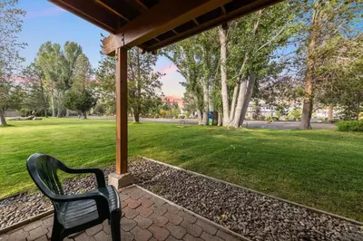 a black bench sitting under a pavilion in a park at 589 Danube Drive condo in South Lake Tahoe
