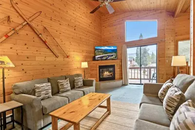 a living room with a couch and a fireplace at 589 Danube Drive condo in South Lake Tahoe