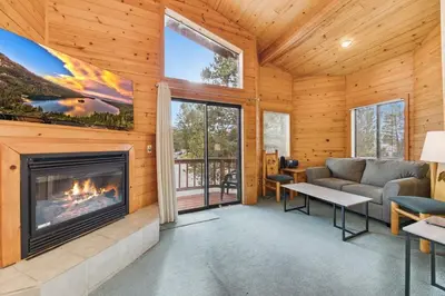 a living room with a fireplace and a couch at 589 Danube Drive condo in South Lake Tahoe