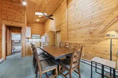a wooden dining room with a table and chairs at 589 Danube Drive condo in South Lake Tahoe