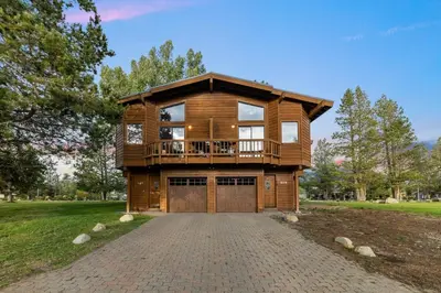 a large wooden house with a balcony on a driveway at 587 Danube Drive condo in South Lake Tahoe