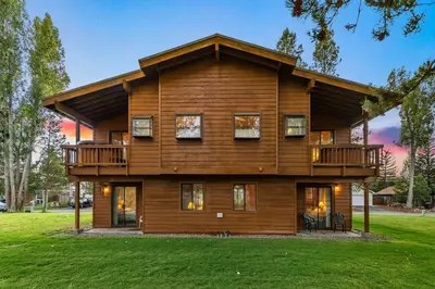 a large wooden house with a wrap around deck at 587 Danube Drive condo in South Lake Tahoe