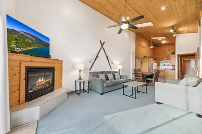 a living room with a fireplace and a couch at 587 Danube Drive condo in South Lake Tahoe