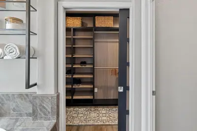 a door into a pantry with a closet at The Executive Retreat at Westberry in Madera