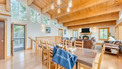 a dining room and living room with a wooden ceiling at Sleeps 20 2 Homes Near Ski Resort Beach Lake Access Pool Homewood in Tahoma