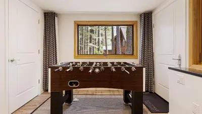 a game room with a table in a room at Sleeps 20 2 Homes Near Ski Resort Beach Lake Access Pool Homewood in Tahoma